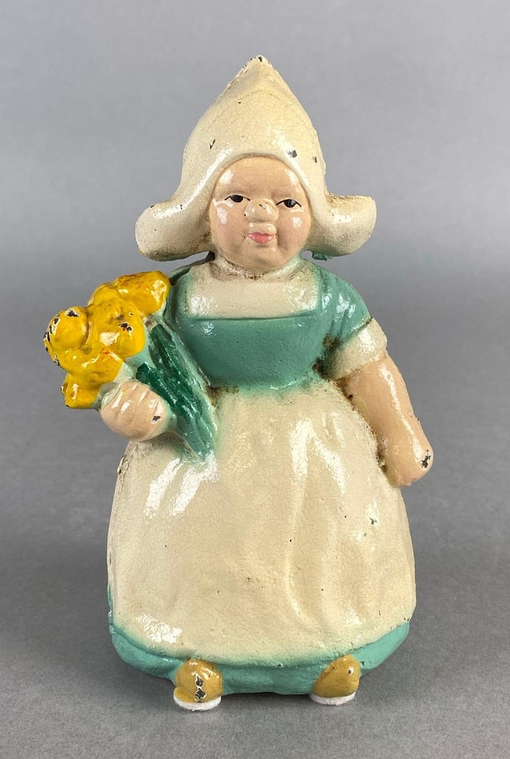 Hubley Cast Iron Dutch Girl Coin Bank: Measures 5 1/2 x 3 1/2 x 2 3/4 inches.