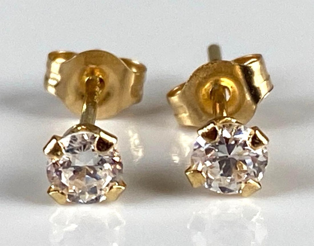 Pair of Small 14K Gold CZ Stud Earrings: Total weight 0.3g, Both measure smaller than 1/4 inch.