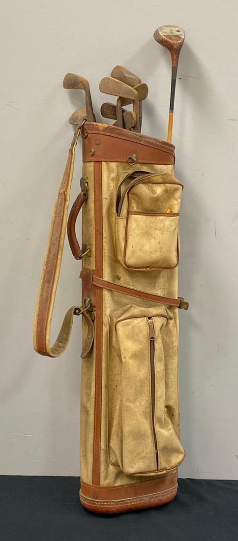 Set of Vintage Golf Clubs and Bag: Rust throughout, creases and tears throughout leather