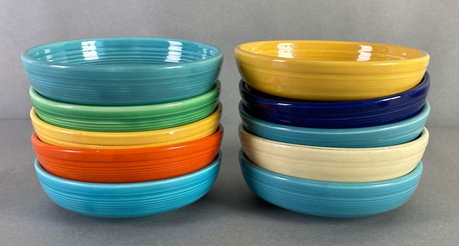 Group of 10 Fiestaware Shallow Round Bowls: Some small chips around rims, All measure 1 3/4 x 6 1/4 x 6 1/4 inches.