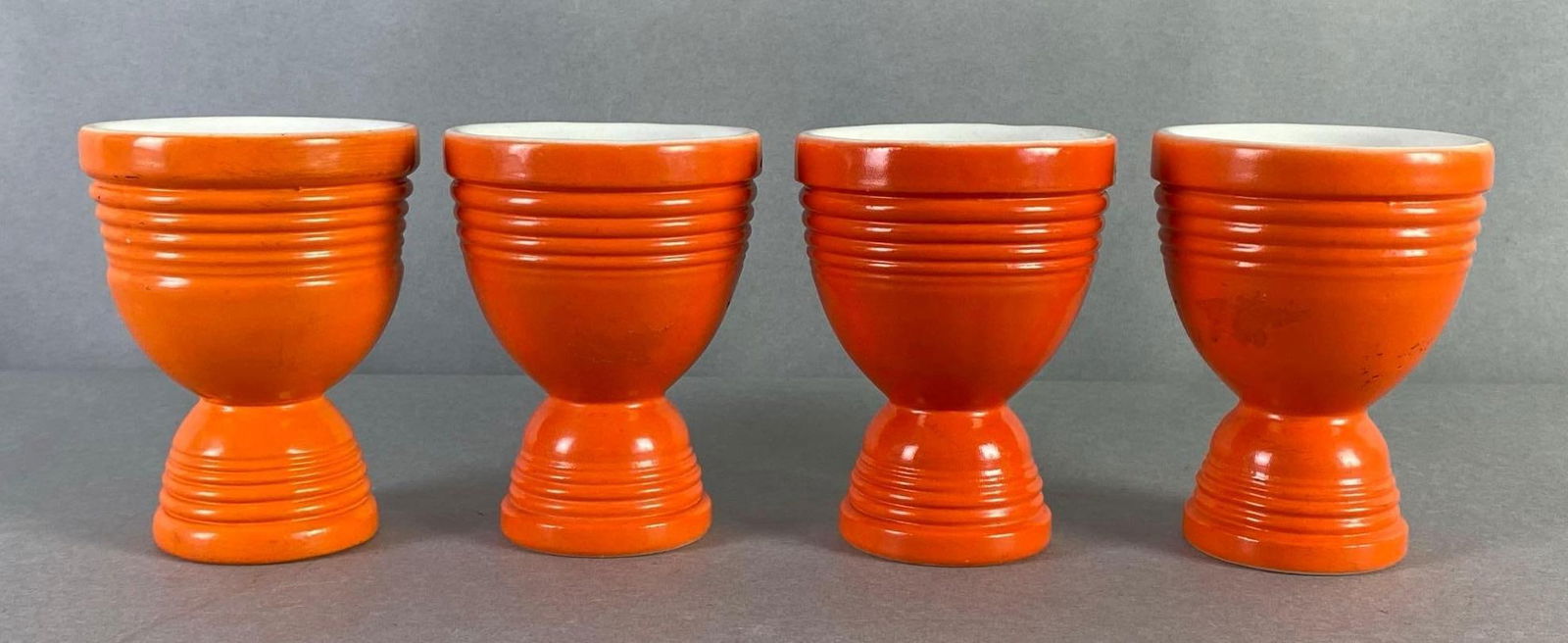 Group of 4 Hankscraft Fiestaware Orange Double Egg Cups: All measure 4 x 3 x 3 inches.