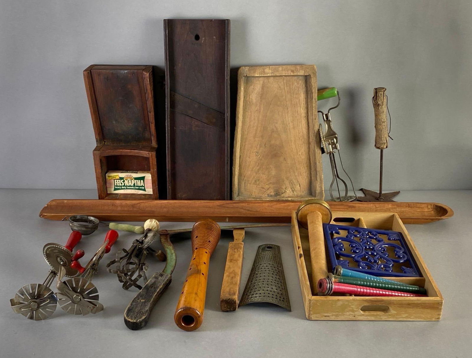Group of Primitive Kitchen Items and More: Includes grater, beaters, trivet, cutlery organizer, and more, Largest measures 39 1/2 x 3 1/2 x 1 1/2 inches.