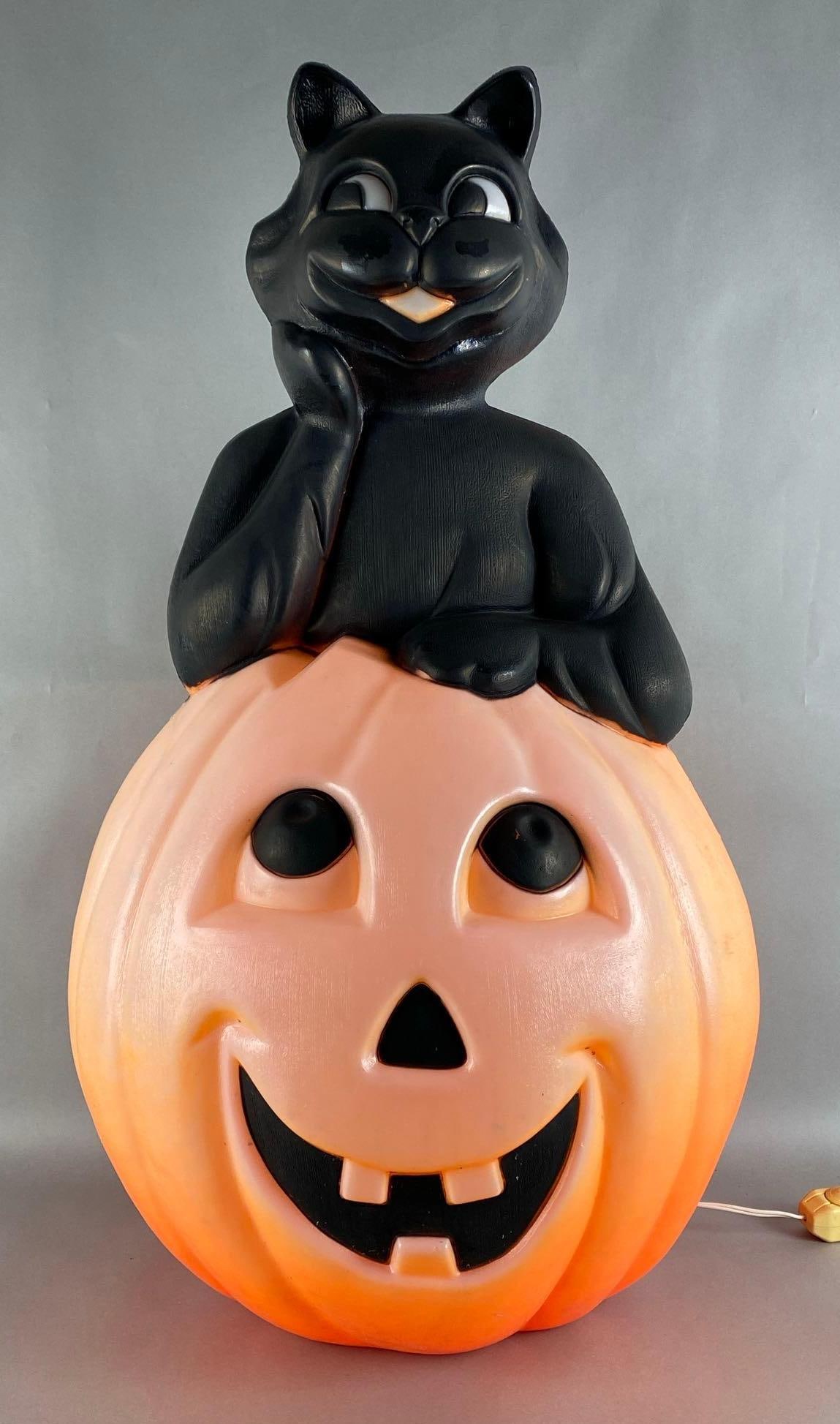 Vintage Halloween Black Cat on Jack-O-Lantern Light-Up Blow Mold: Not in working condition, Measures 38 x 18 x 15 inches.
