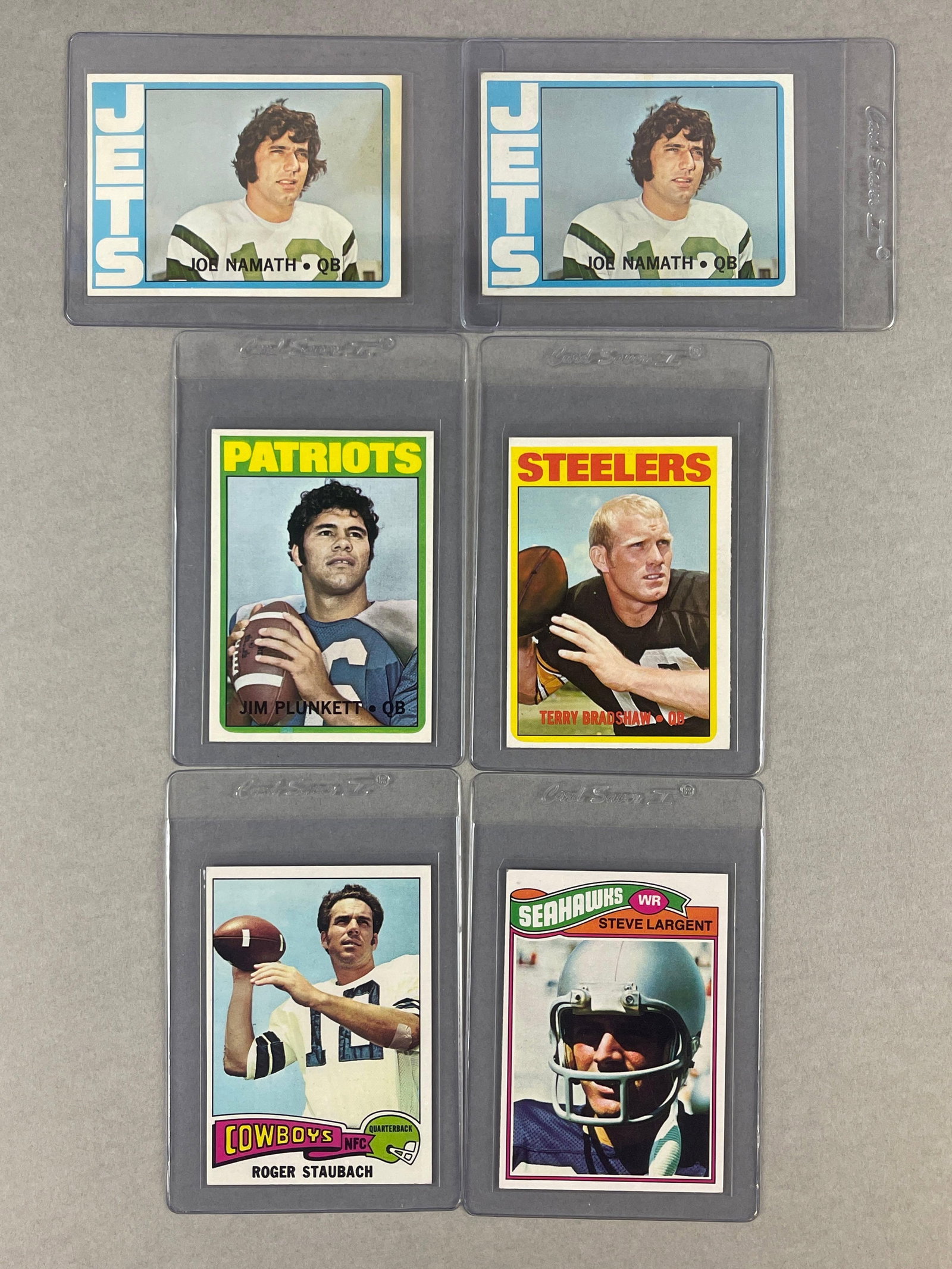 6 - 1970s Topps Football HOFs and Rookies Cards: 1972 Terry Bradshaw EX, 2 - 1972 Joe Namath EXMT, Low, 1972 Jim Plunkett Rookie NM or Better, 1975 Roger Staubach EXMT, 1977 Steve Larget Rookie EX - EXMT