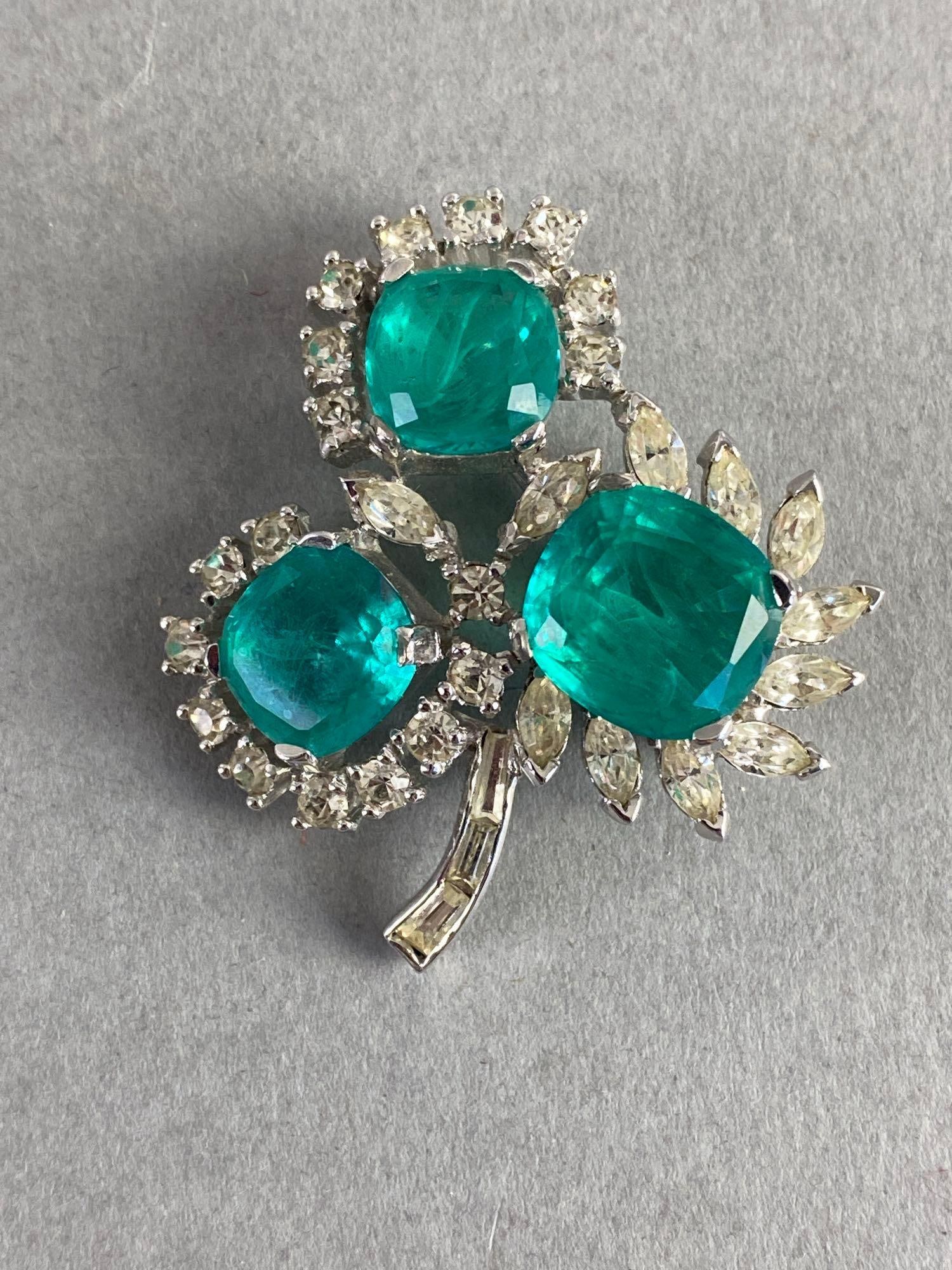 Jomaz Green Rhinestone Shamrock Brooch: Measures 2 x 1 3/4 inches.