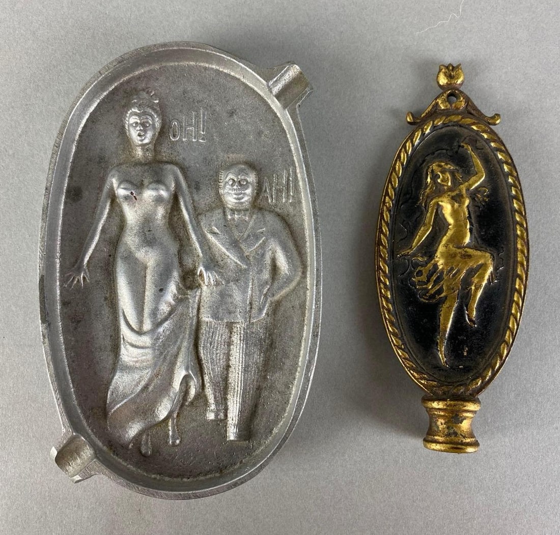 Group of 2 Risqué Metal Items: Includes ashtray and unknown topper, largest measures 5 1/2 x 3 1/2 inches