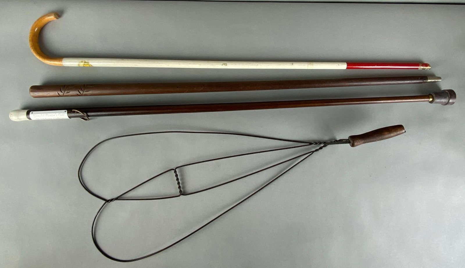 Group of 4 Canes and Rug Beater: Includes Painters came from middlebury college class of 1959 and braille instrument of America Inc, largest measures 41 inches in length