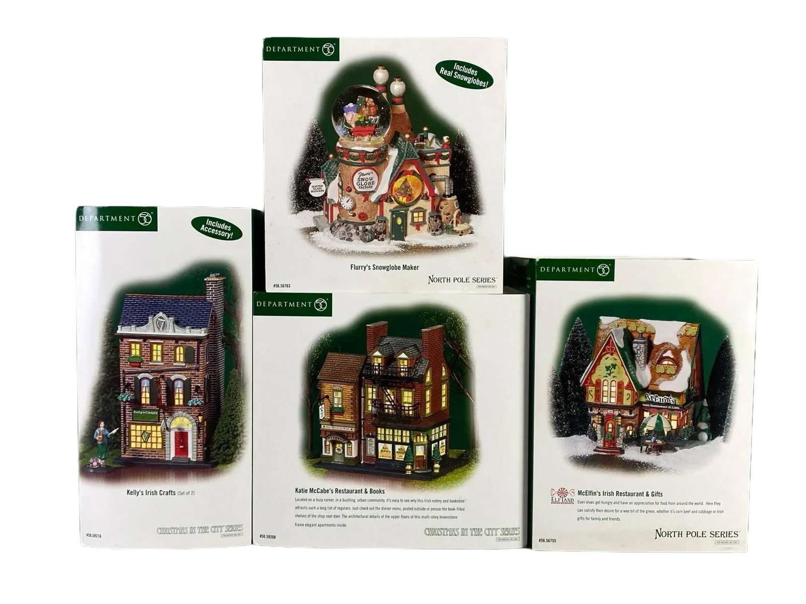 Group of Department 56 Christmas Village Buildings: Includes Kellys Irish Crafts, Flurrys Snowglobe Maker, Katie McCabes Restaurant and Books, and McElfins Irish Restaurant and Gifts, In original boxes, Largest box measures 8 3/4 x 9 1/2 x 7 inches.