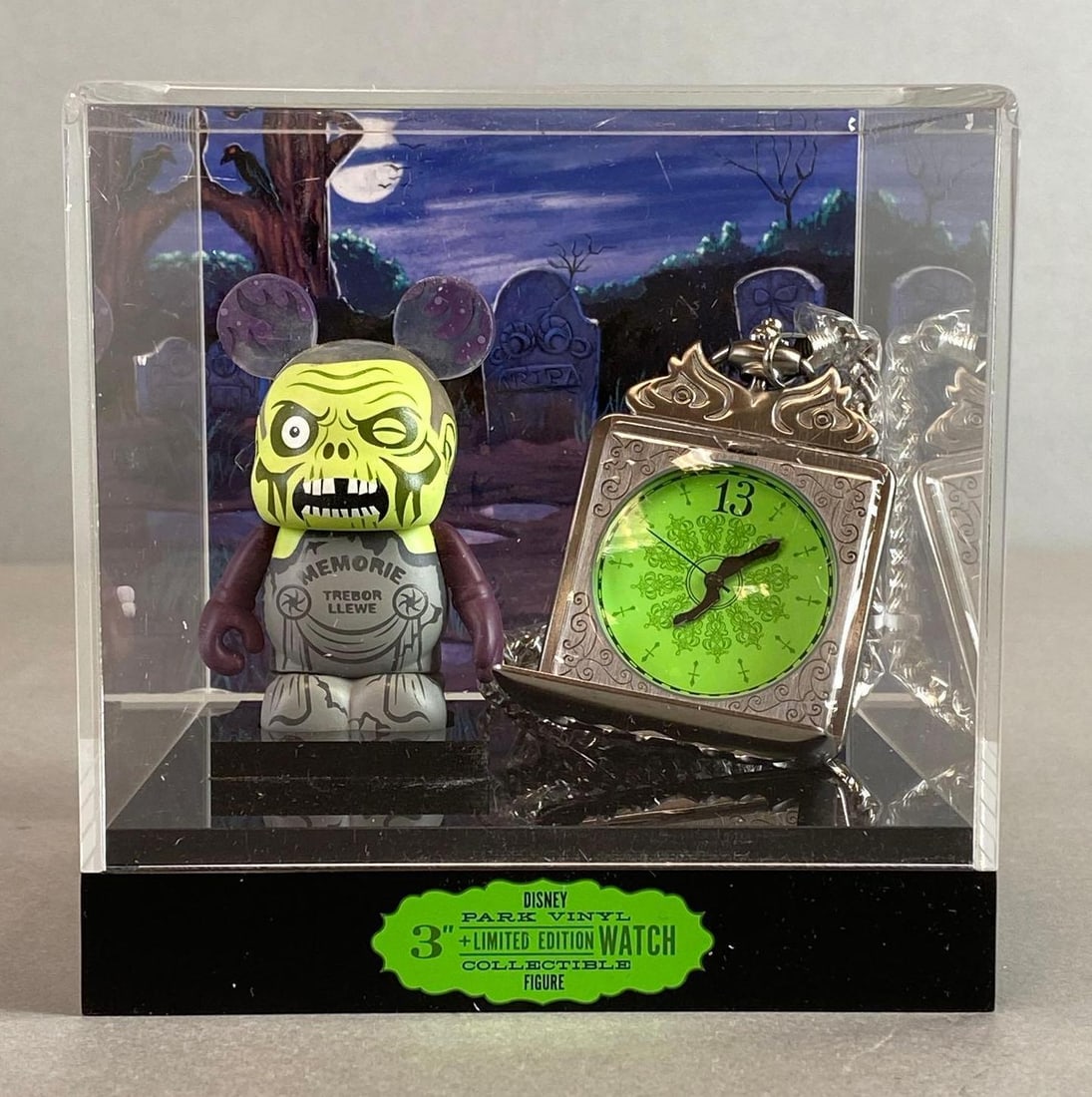 Disney Vinylmation Haunted Mansion Pocketwatch and Figure: Limited Edition of 750, Missing small piece to hold Watch upright in case, With original box, Box measures 7 3/4 x 7 3/4 x 7 3/4 inches.
