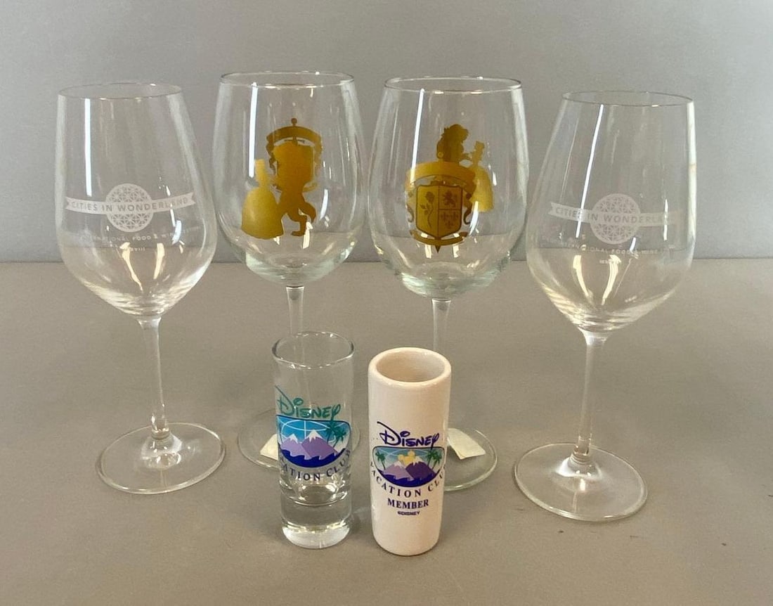 Group Disney Beauty and Beast Glass Drink Ware: Includes Wine glasses and shot glasses. Largest measures 9 x 4 inches.
