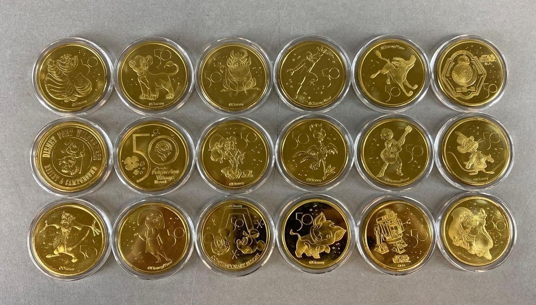 Group of Disney 50th Anniversary Tokens: Includes Simba, Dumbo, Mickey Mouse and more. Token measures 1 3/4 inches across.