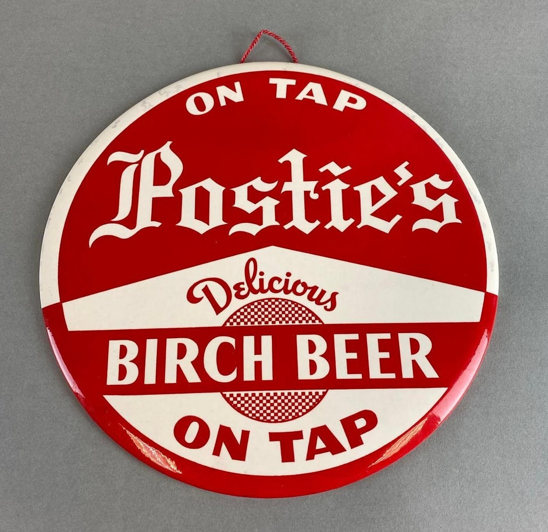 Postie’s Plastic on Cardboard Advertising Beer Sign: With easel. Measures 1/4 x 9 x 9 inches.