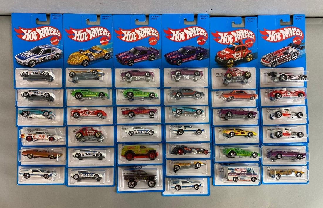 Group of 30+ Mattel Hot Wheels Die-Cast Cars: Like new in original packaging. Includes ‘70 Pontiac GTO, Hammered Coupe, Volkswagen SP2 and more.
