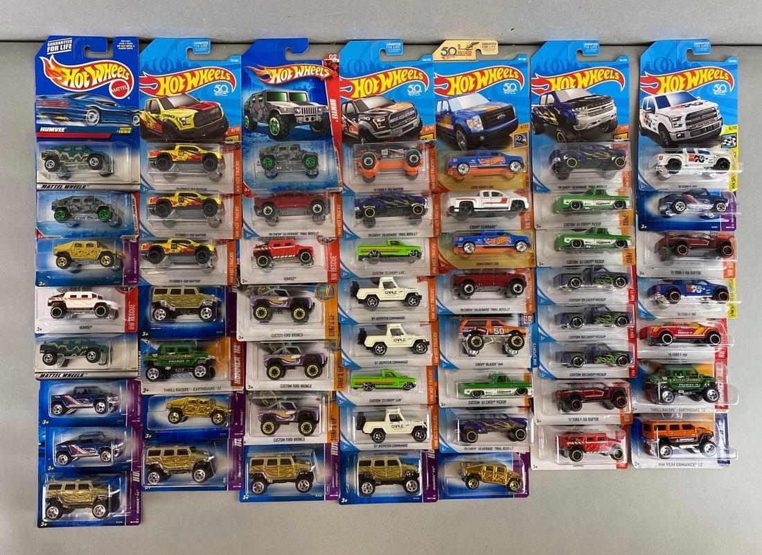 Group of 50+ Mattel Hot Wheel Die-Cast Trucks: Like new in original packaging. Includes Jeep, Ford, Chevrolet and more.