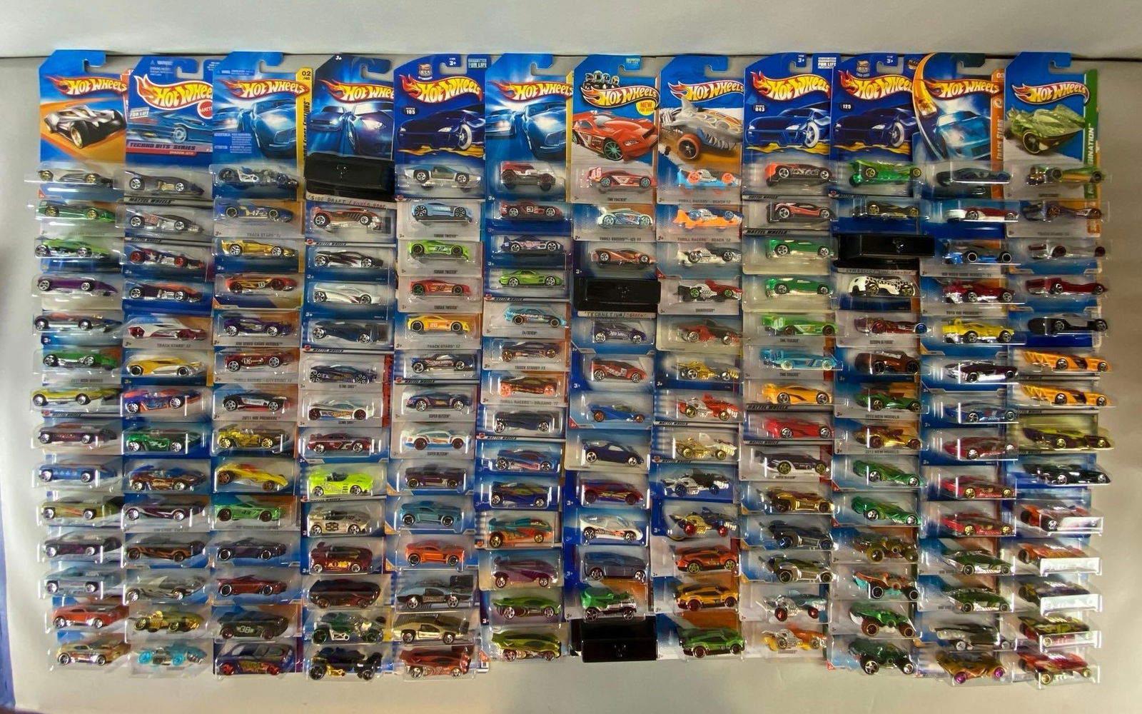 Group of 160+ Mattel Hot Wheels Die-Cast Exotic Cars: Like new in original packaging, includes shell shock, sharkruiser, swamp buggy and more