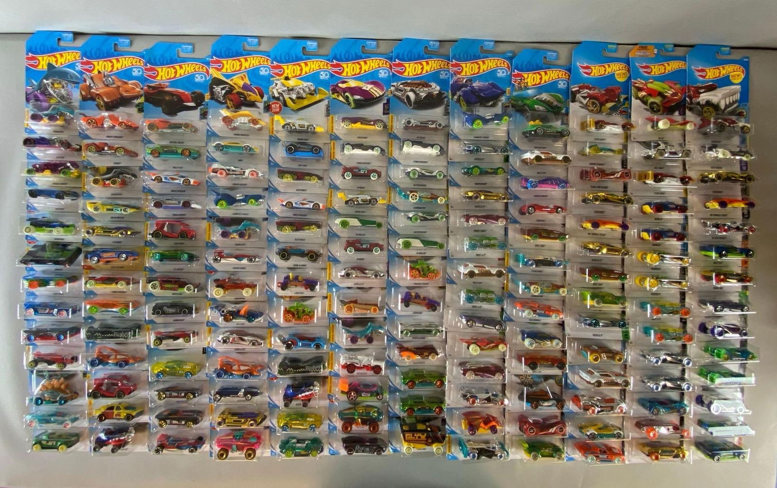 Group of 150+ Mattel Hot Wheels Die-Cast Exotic Cars: Like new in original packaging, includes Rally cat, Rogue Hog, Hollowback and more