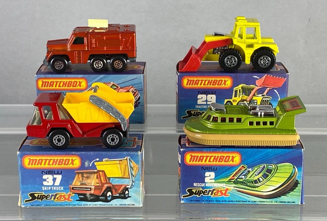 Group of 4 Matchbox Die-Cast Vehicles: With boxes, Includes No. 2 Rescue Hovercraft, No. 16 Badger, No. 29 Tractor Shovel, and No. 37 Skip Truck.