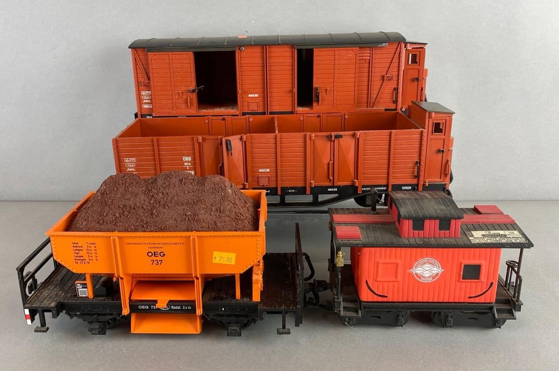 Group of G Scale LGB Boxcars and more: Includes Beam Decanter passenger car, boxcar, tender and more. Largest measures 17 1/2 inches.