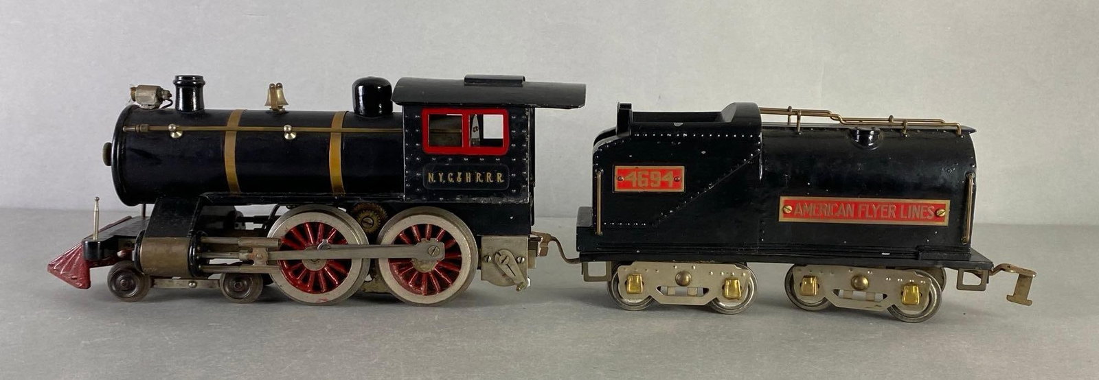 Pre-War American Flyer S Scale No. 4694 NYC and HRRR Steam Locomotive and Tender: Untested, Front bulb broken, Locomotive measure 13 1/2 inches long.