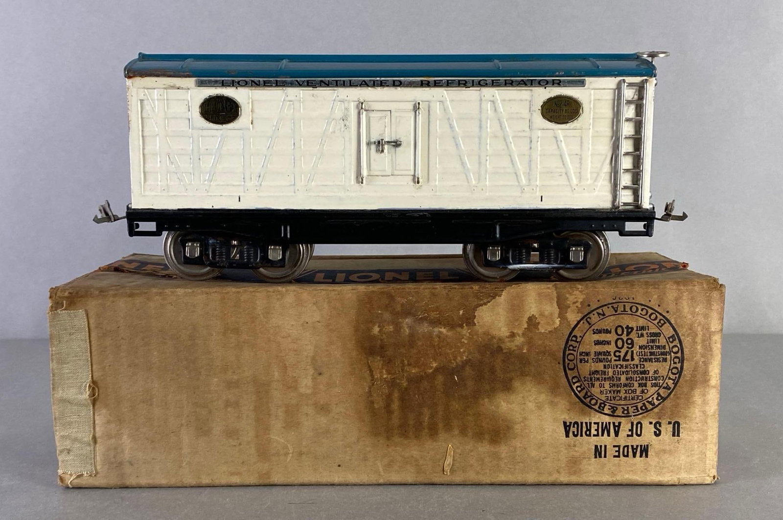 Pre-War Lionel Lines No. 214R Ventilated Refrigerator Car: With original box, Train car measures 13 inches long, Some moisture damage on box.