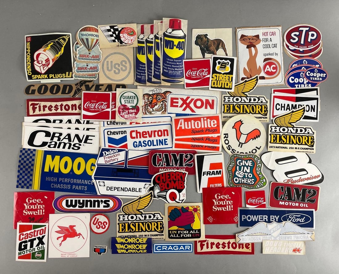 Group of Auto Related Advertising Decals and Stickers: Includes Coca-Cola, STP, Honda, and more. Largest measures 3 1/2 x 8 1/2 inches