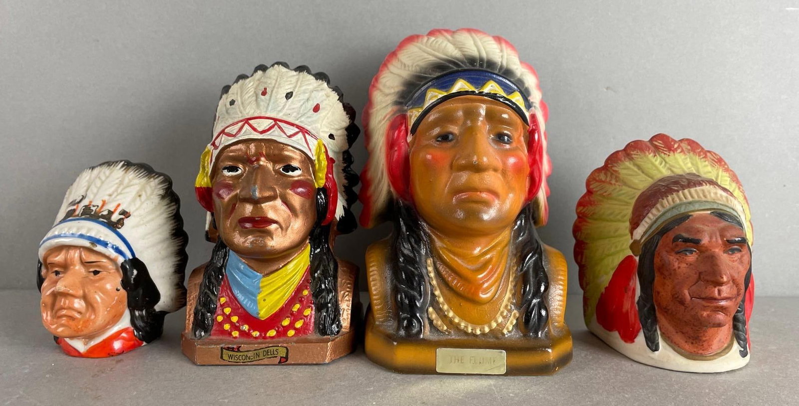 Group of Native American Chief Bust Banks: Includes ceramic bank, chalk Wisconsin dells, and more. Tallest measures 5 3/4 inches