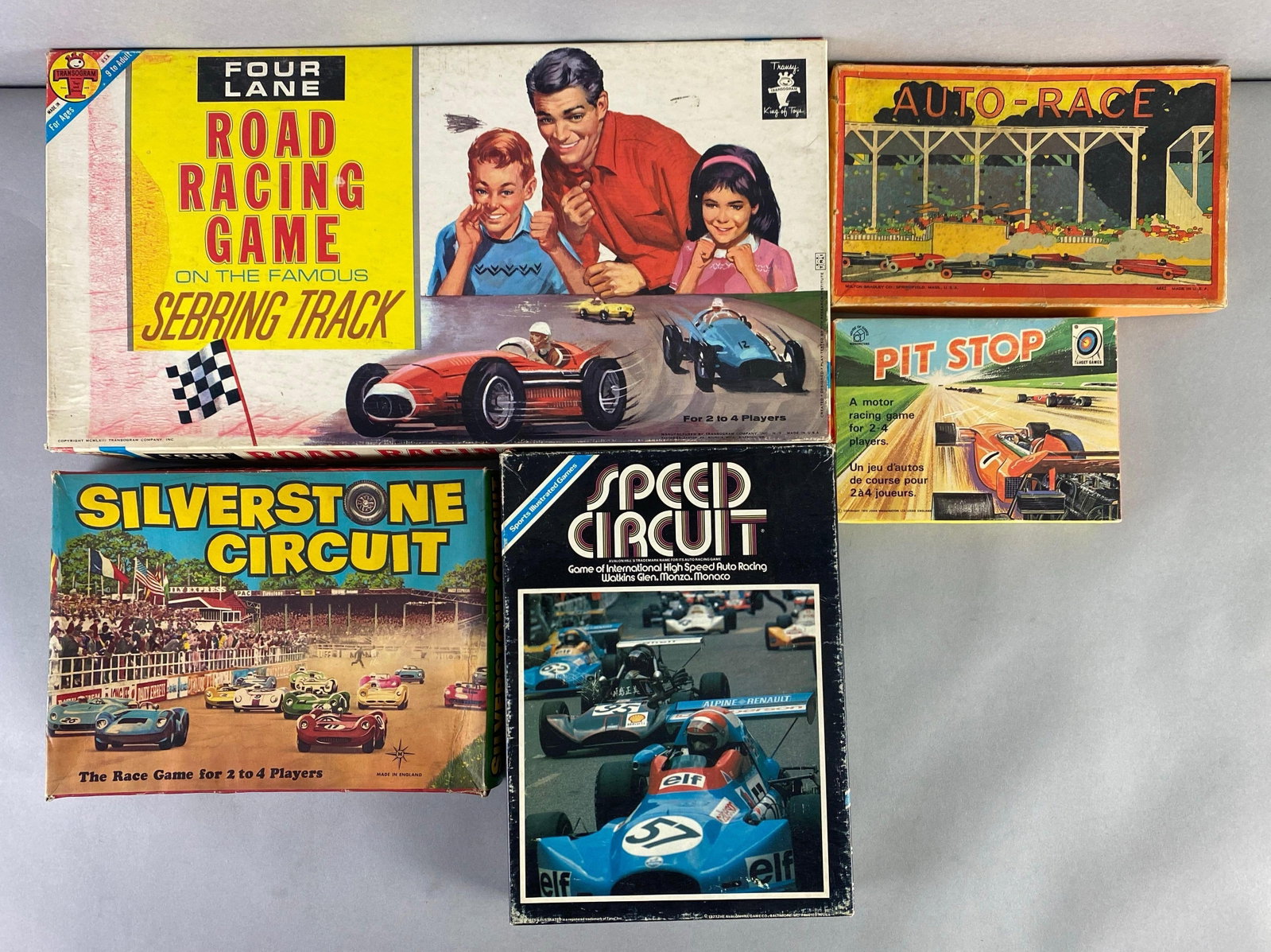 Group of Vintage Tabletop Racing Board Gamea: Unknown set completion, includes pit stop, auto-race, silver tone circuit and more, largest measures 19 1/2 x 10 x 2 inches