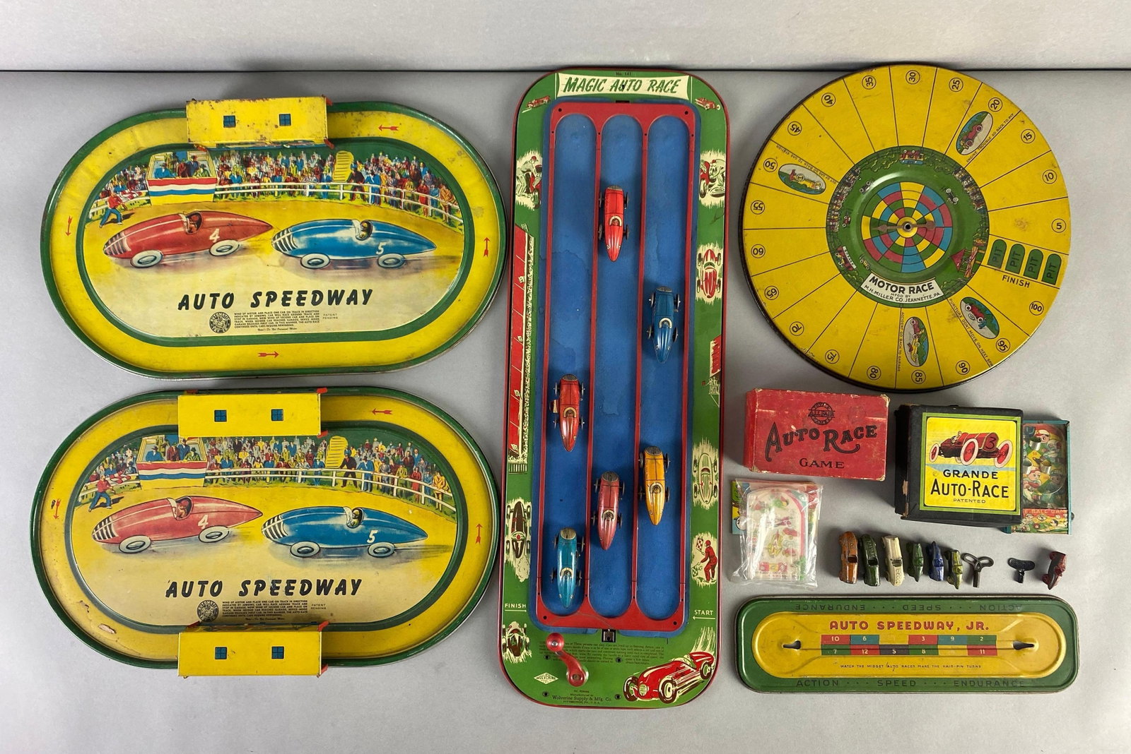 Group of Assorted Tabletop Tin Litho Racing Games and Pieces: Includes friction cars, die-Cast, tin litho and more, largest measures 23 x 8 inches
