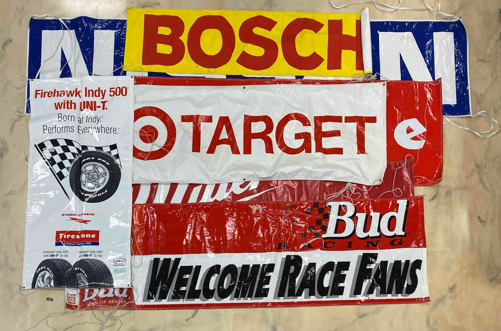 Group of Advertising Racing Automobile Banners and More: Includes Firestone, Miller high life, Nissan and more, largest measures 150 x 36 inches
