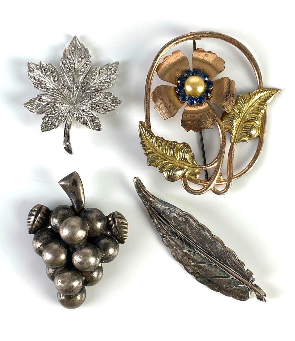 Group of 4 Sterling Silver Brooch Pins: Total weight 36.4g, Includes Maple leaf, flower, leaf, and grapes, Largest measures 2 1/4 x 1 3/4 inches.