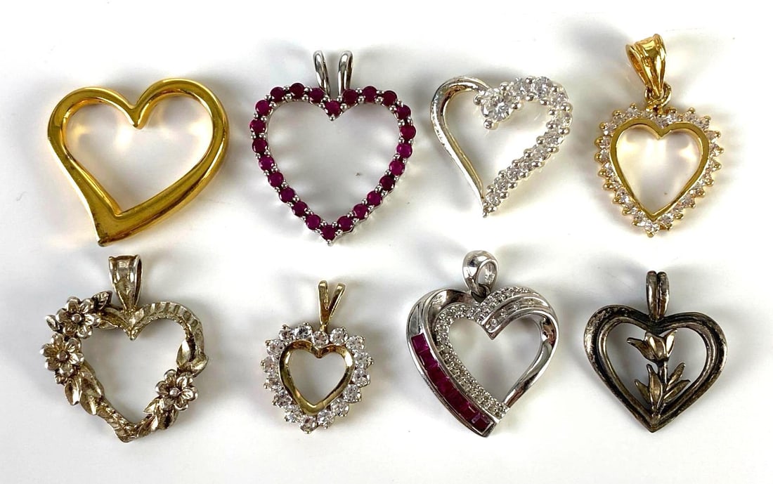 Group of 8 Sterling Silver Heart Necklace Pendants: Total weight 18.0g, Includes Ruby, CZ, floral, and more, Largest measures 1 inch long.