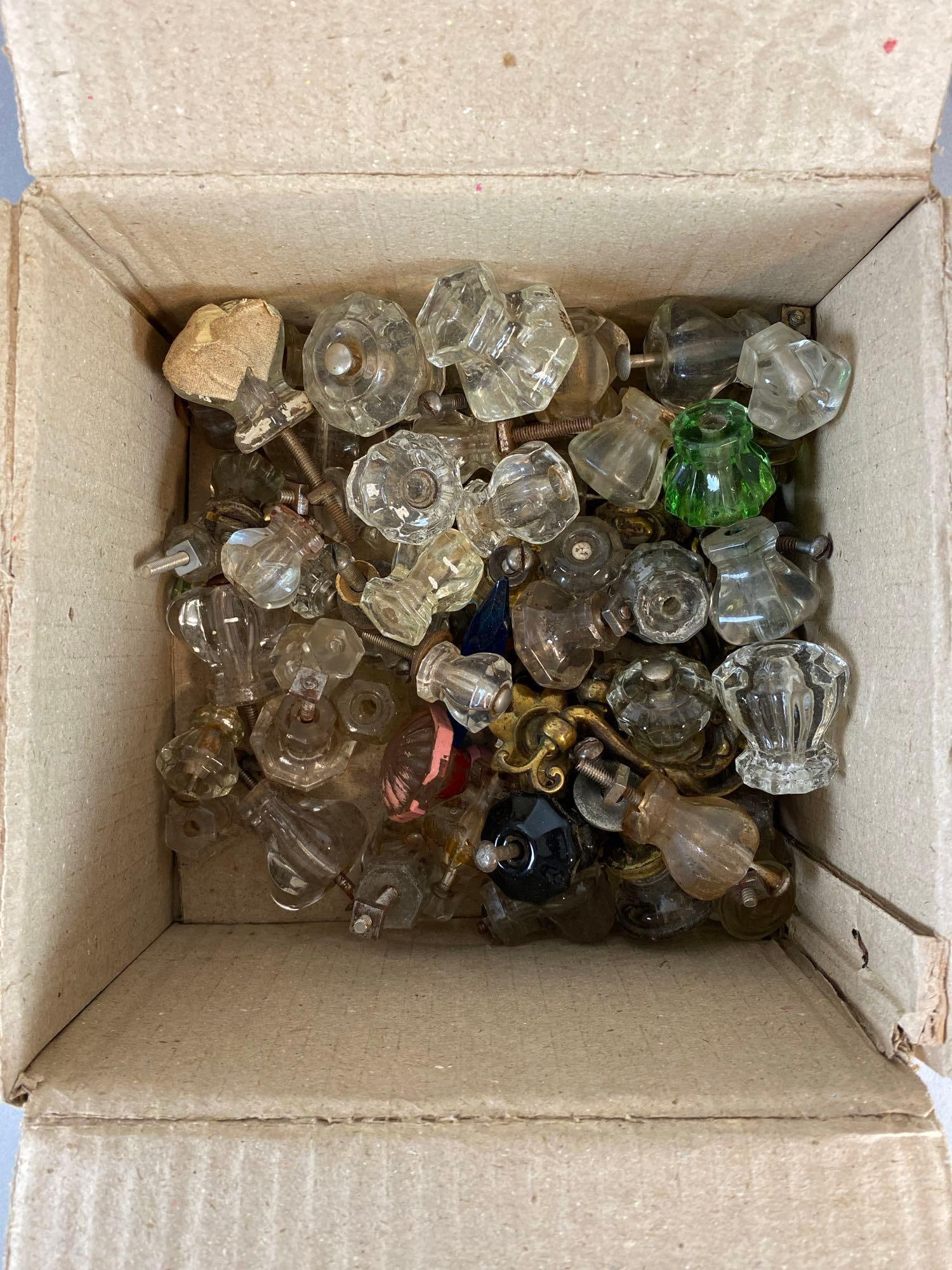 Group of Vintage Door Pulls: Includes glass and metal pulls. Largest measures 4 x 3 x 1 inches.