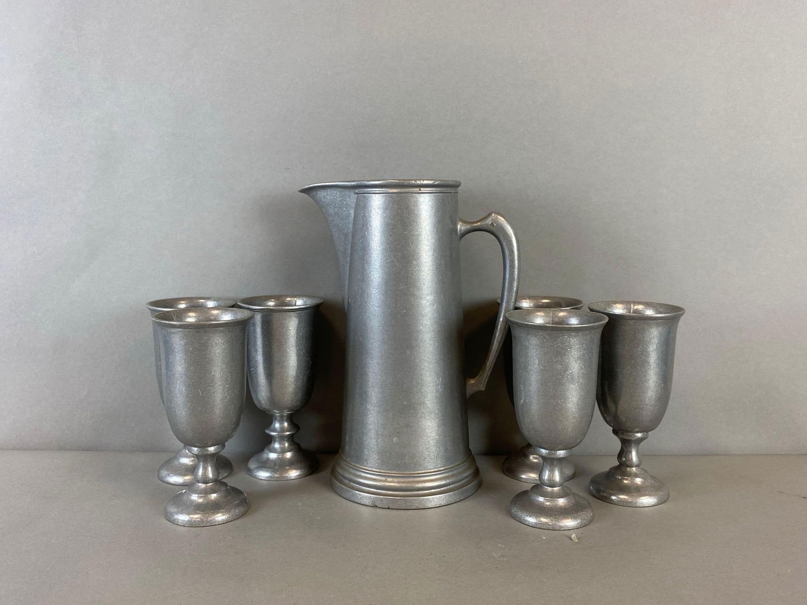 Group of 6 Wilton Armetale Pewter Chalices and a Pitcher: Makers mark present on Pitcher. Largest it measures 12 x 9 x 6 inches.