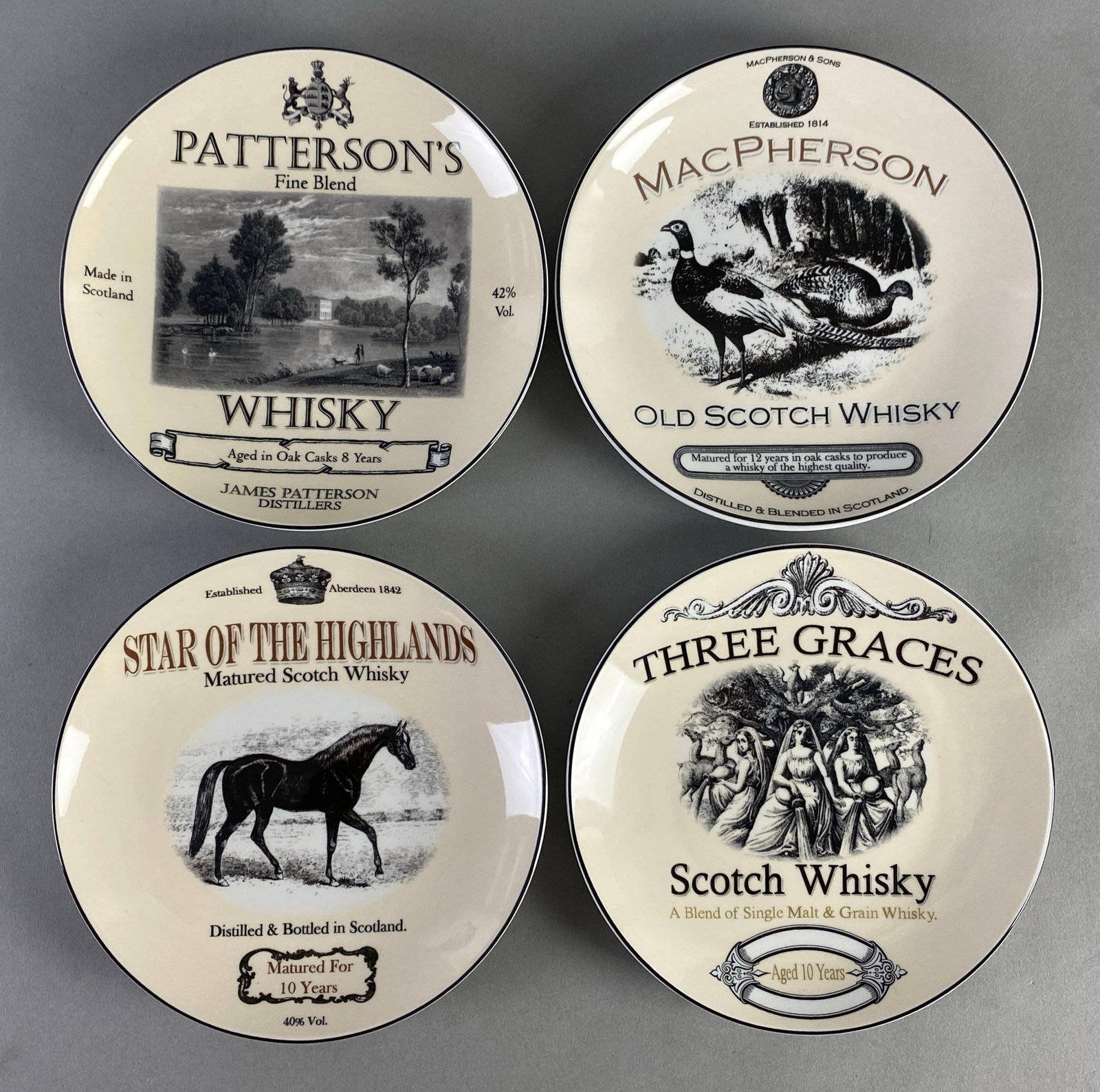 Set of 4 Restoration Hardware Liquor Porcelain Plates: in original box, each plate measures 6 1/2 inches in diameter