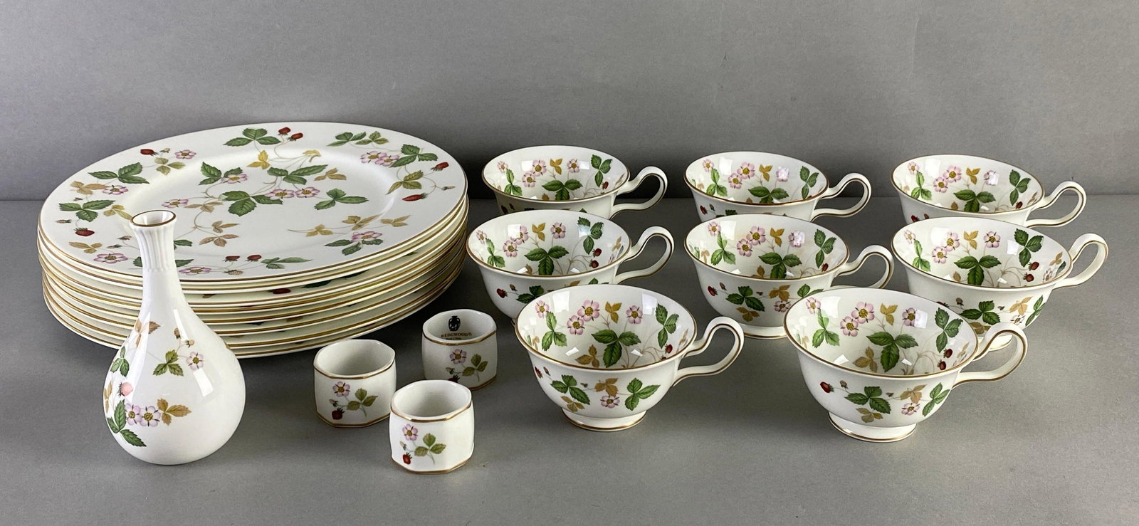Set of Wedgwood Wild Strawberry Porcelain Dinnerware: Includes dinner plates, flute, napkin holders and teacups, plates each measures