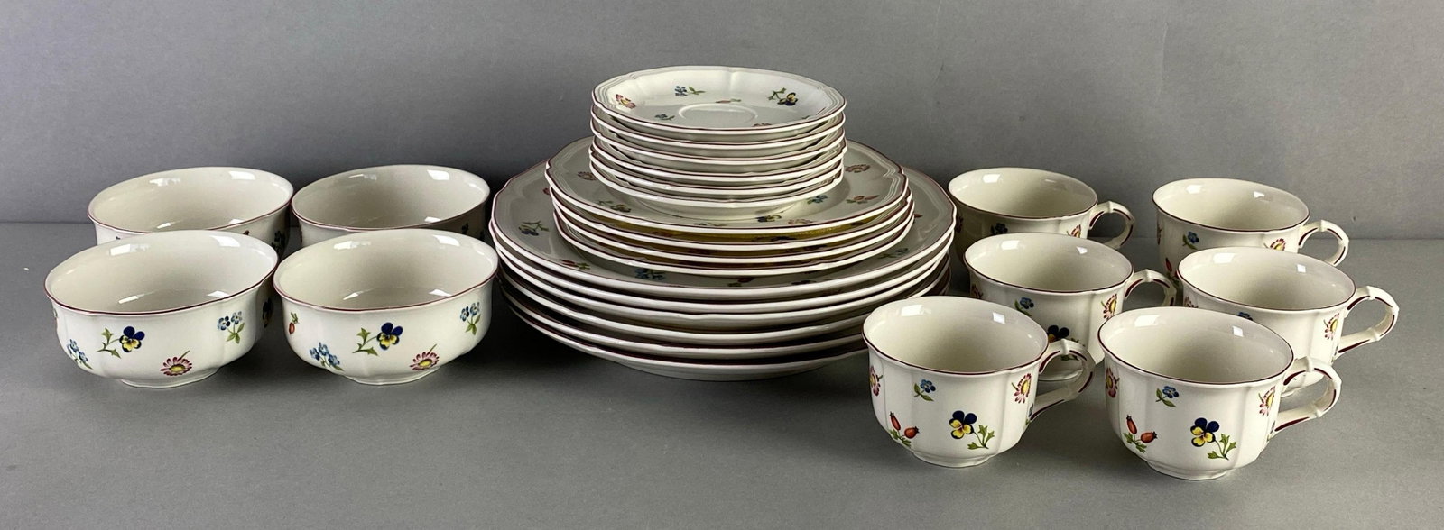 Group of Villeroy and Boch Petite Fleur Porcelain Dinnerware: Includes bowls, teacups, saucers and more, largest measures 10 1/2 inches diameter