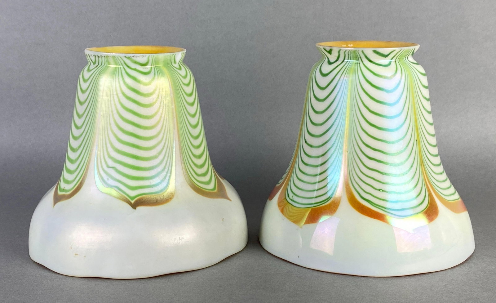 Group of 2 Steuben Green Opalescent Pulled Feather: Small chips on fittings, Each measures 4 1/2 x 4 3/4 x 4 3/4 inches with 2 inch fittings