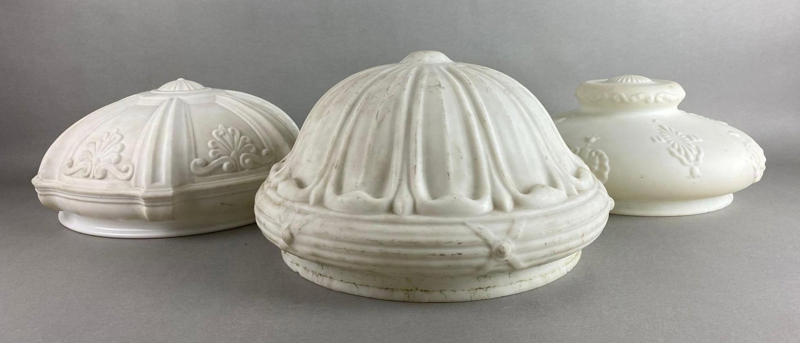 Group of 3 Pressed White Glass Ceiling Lamp Shades: Some chips on fitting. Largest measures 7 3/4 x 12 x 12 inches. Fitting measures 12 inches.