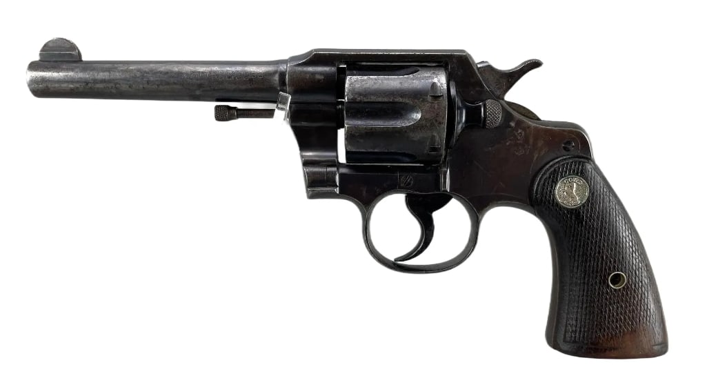 Colt Official Police .38 Cal. Double Action Revolver: Serial # 541778. 5 inch barrel, includes holster