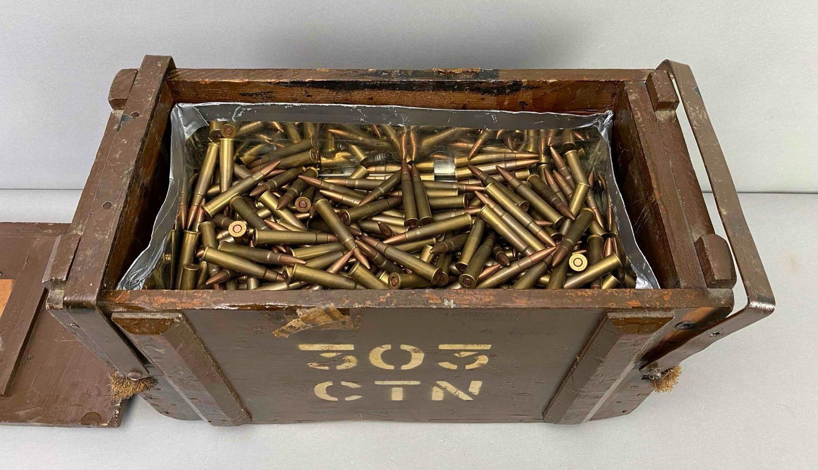 Group of .303 Cal. British Full Metal Jacket Cartridges In Wood Ammo Box: box is half Full, includes spam can is stuck in bottom of box taking up other half, box measures 11 x 16 1/2 x 8 inches