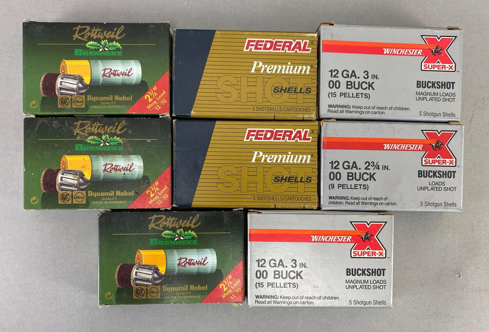 Group of 35+ Rounds of 12 Gauge Shotgun Shells: Includes buckshot and slugs, includes 6 full boxes with 5 shells per box and 2 partial boxes