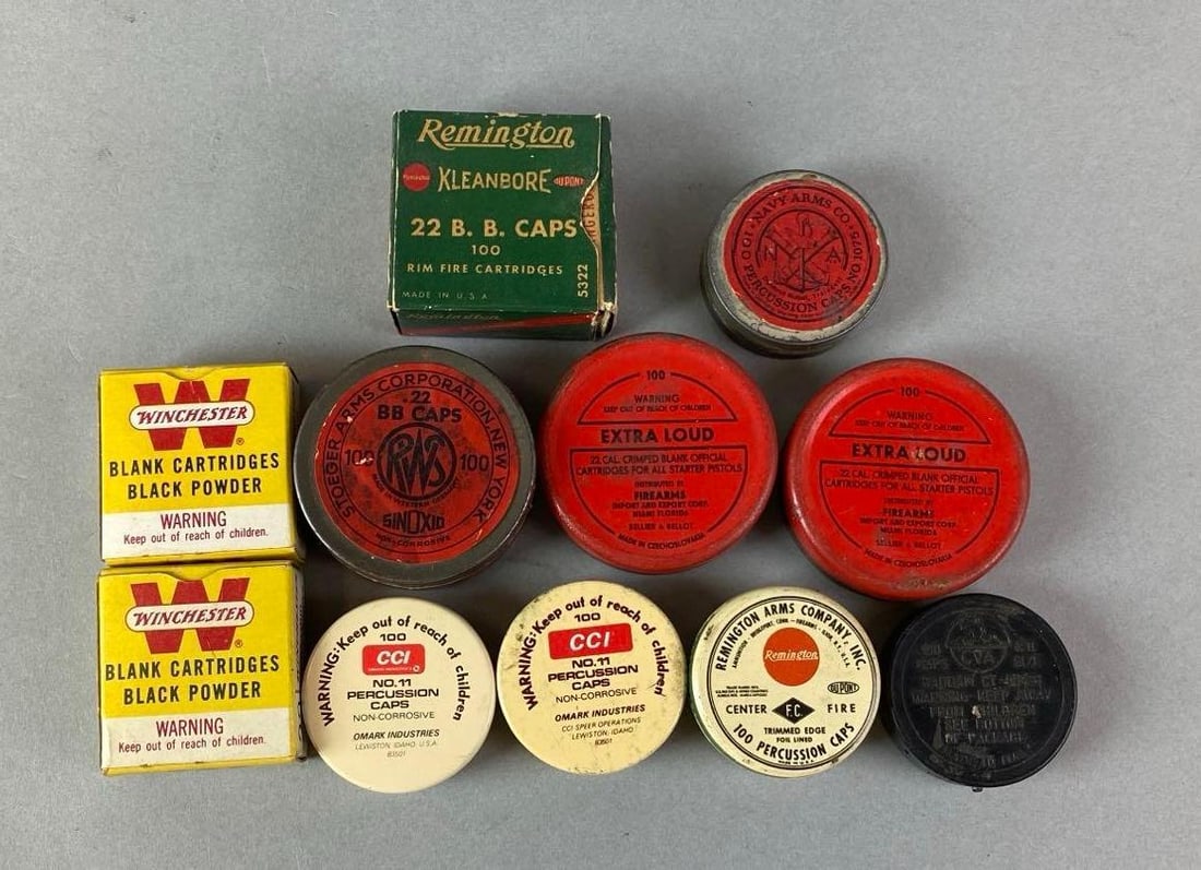 Group of Percussion Caps and Blanks: Including Remington, Winchester, CCI and more. 2 x 2 x 3/8 inches.