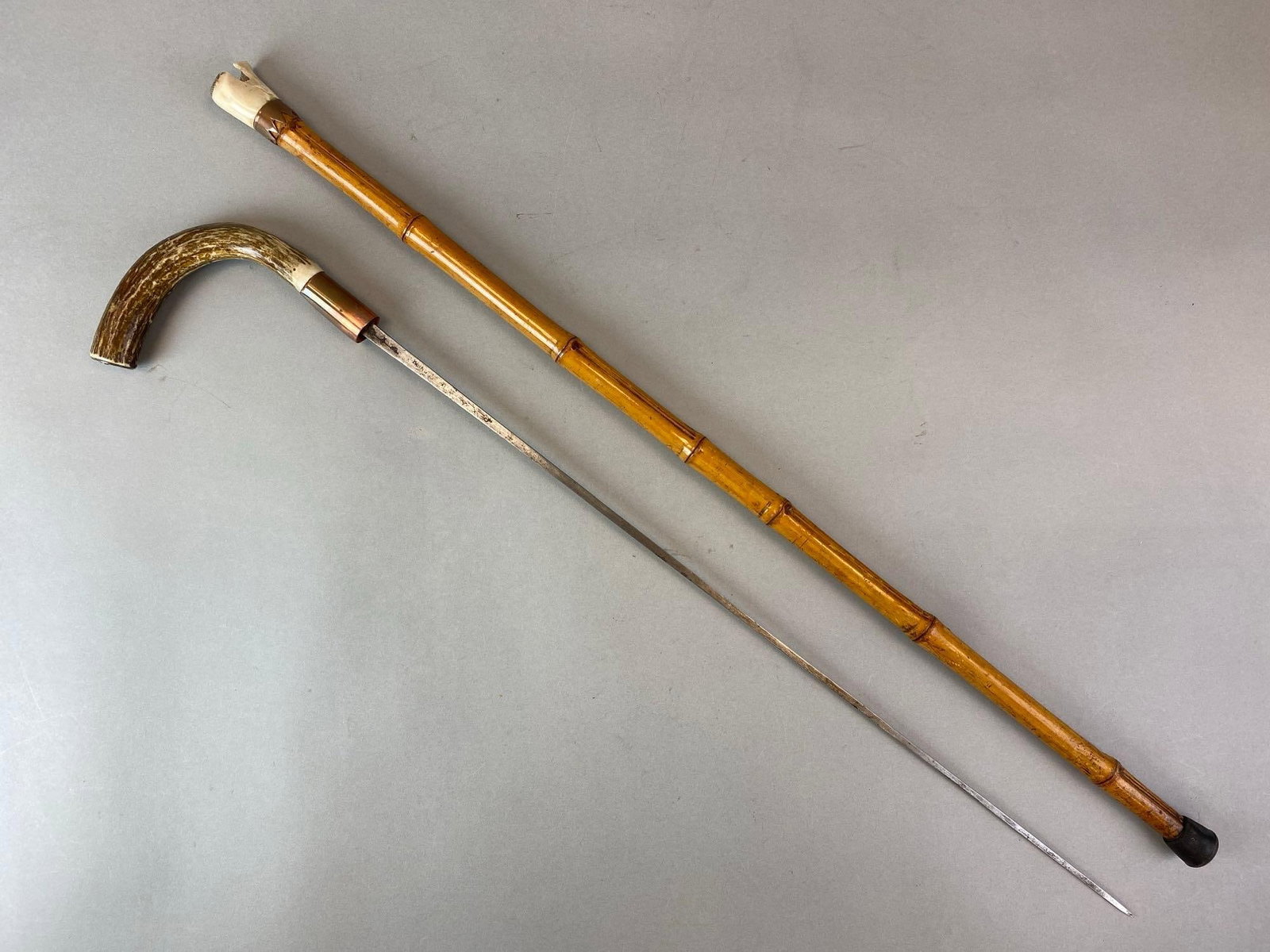 Stag Handle Grip Cane Sword with Bamboo Sheath: Some damage. Measures inches 29 1/2 overall with 24 inch blade.