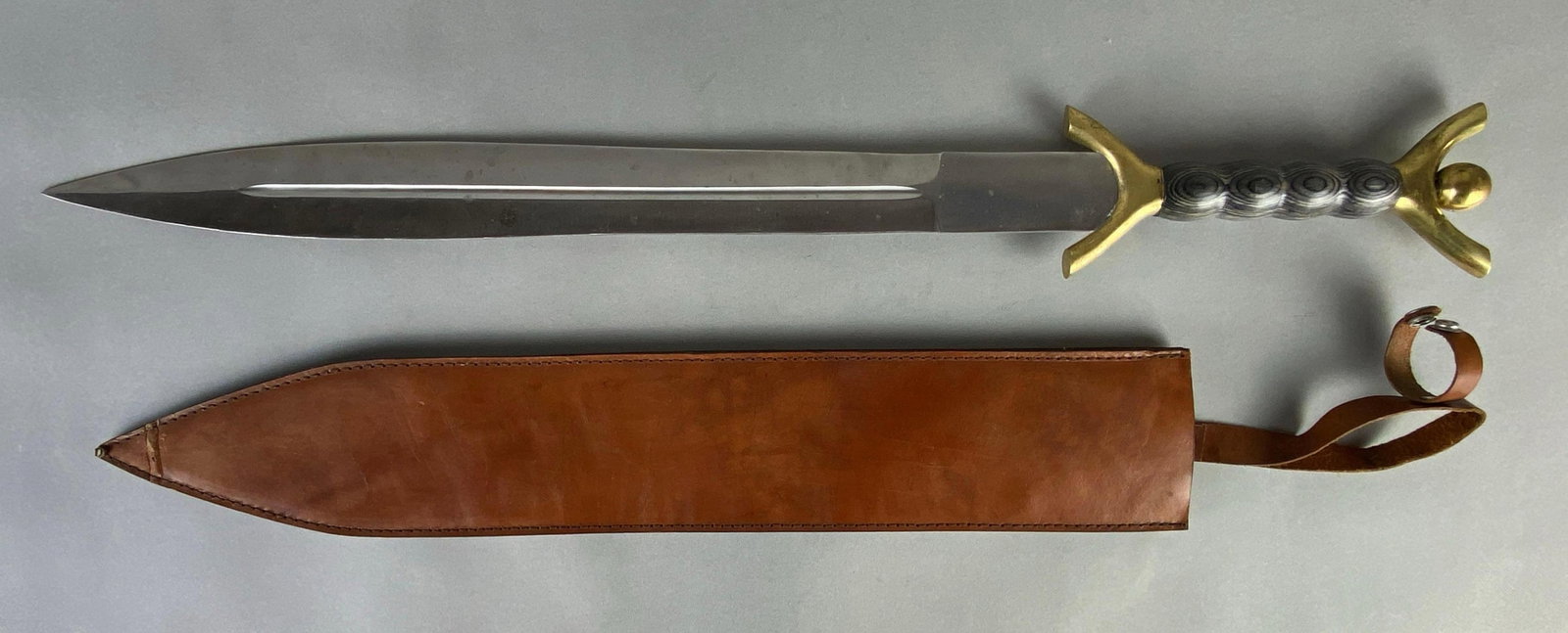 Celtic Style Short Sword with Leather Sheath: Made in Pakistan, Crease on tip of sheath, Sword measures 30 inches long, Blade measures 22 1/2 inches long.