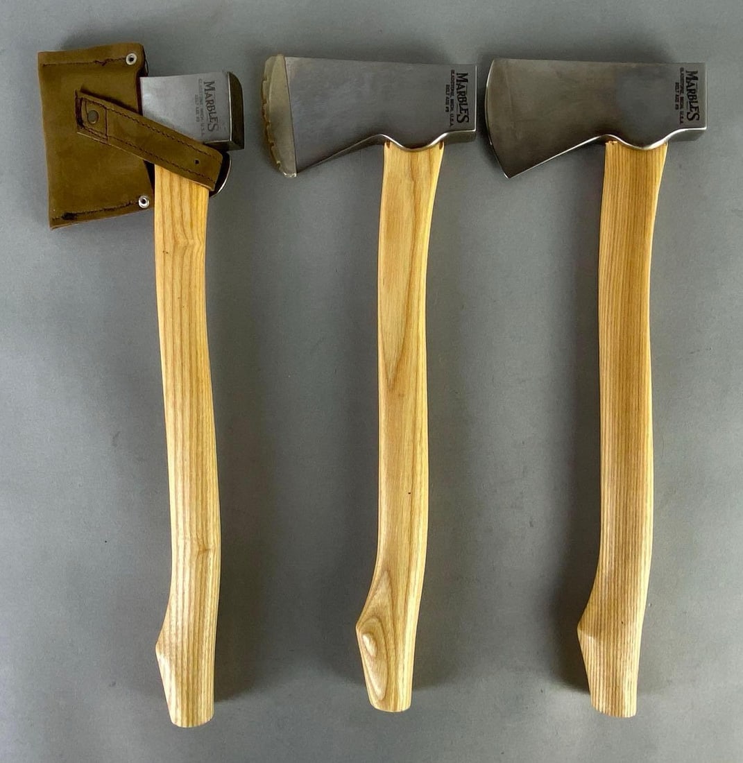 Group of 3 Marbles Belt Axe No. 9s: Gladstone Michigan, One with leather guard, All measure 14 inches long with 4 3/4 inch long heads.