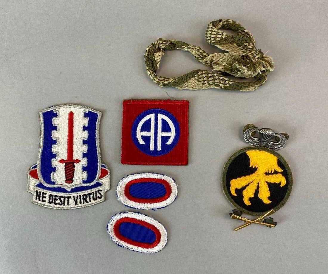 Group of Airborne and Air Assault Patches and More: From either WW2 or Vietnam war. Includes Army field sewing threads, patches and pins. Largest item measures 3 3/4 x 2 3/4 inches.