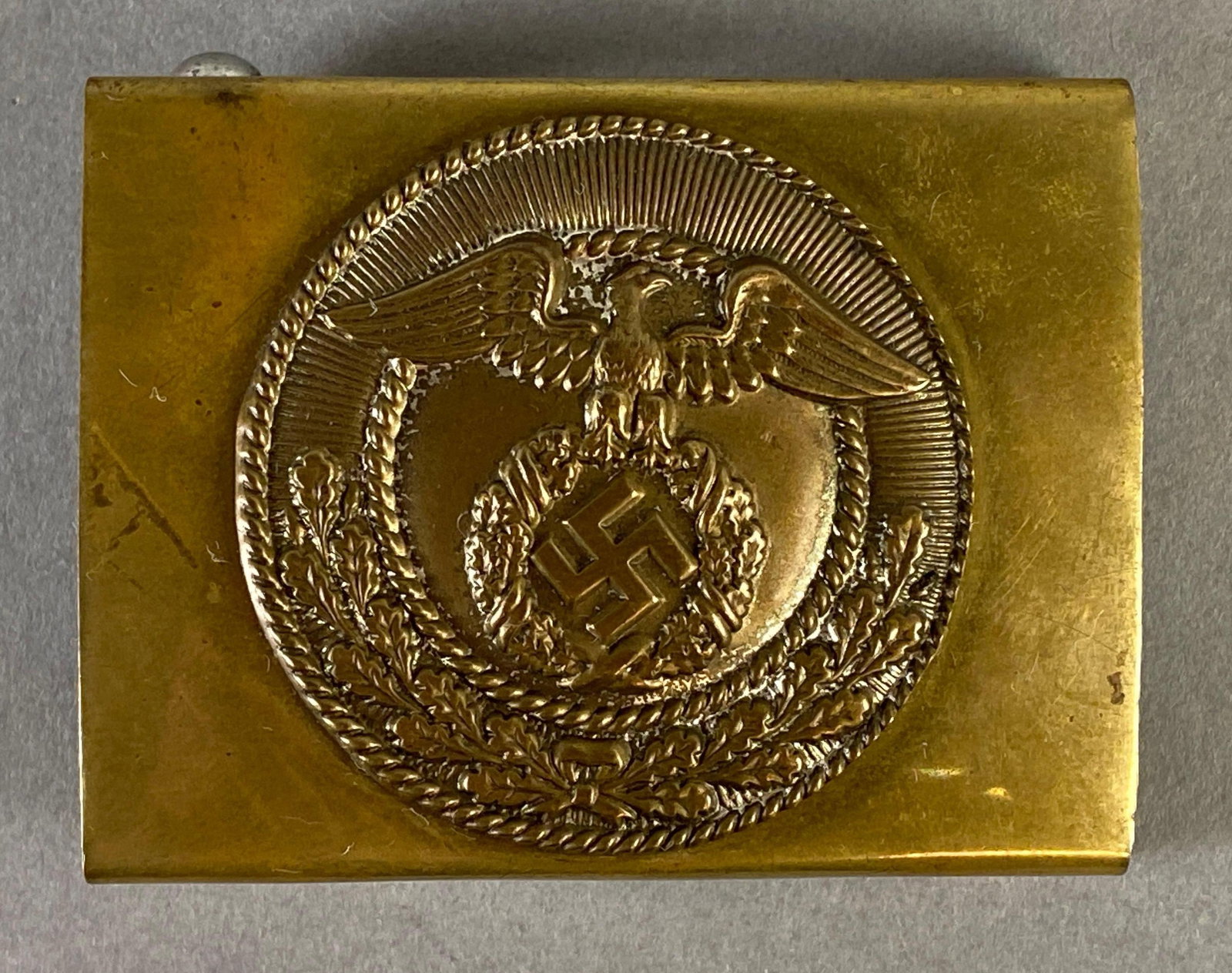 WW2 German SA Belt Buckle: Measures 2 x 2 1/2 x 3/4 inches.