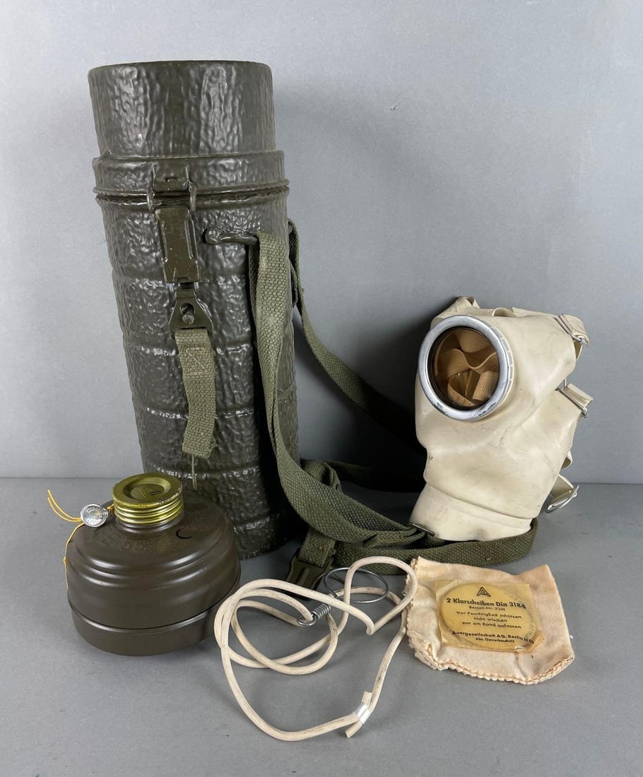 Post WW2 German Bundeswehr Gas Mask Kit: Includes canister, mask, lenses, cloth, unused canister. Measures 13 x 5 inches