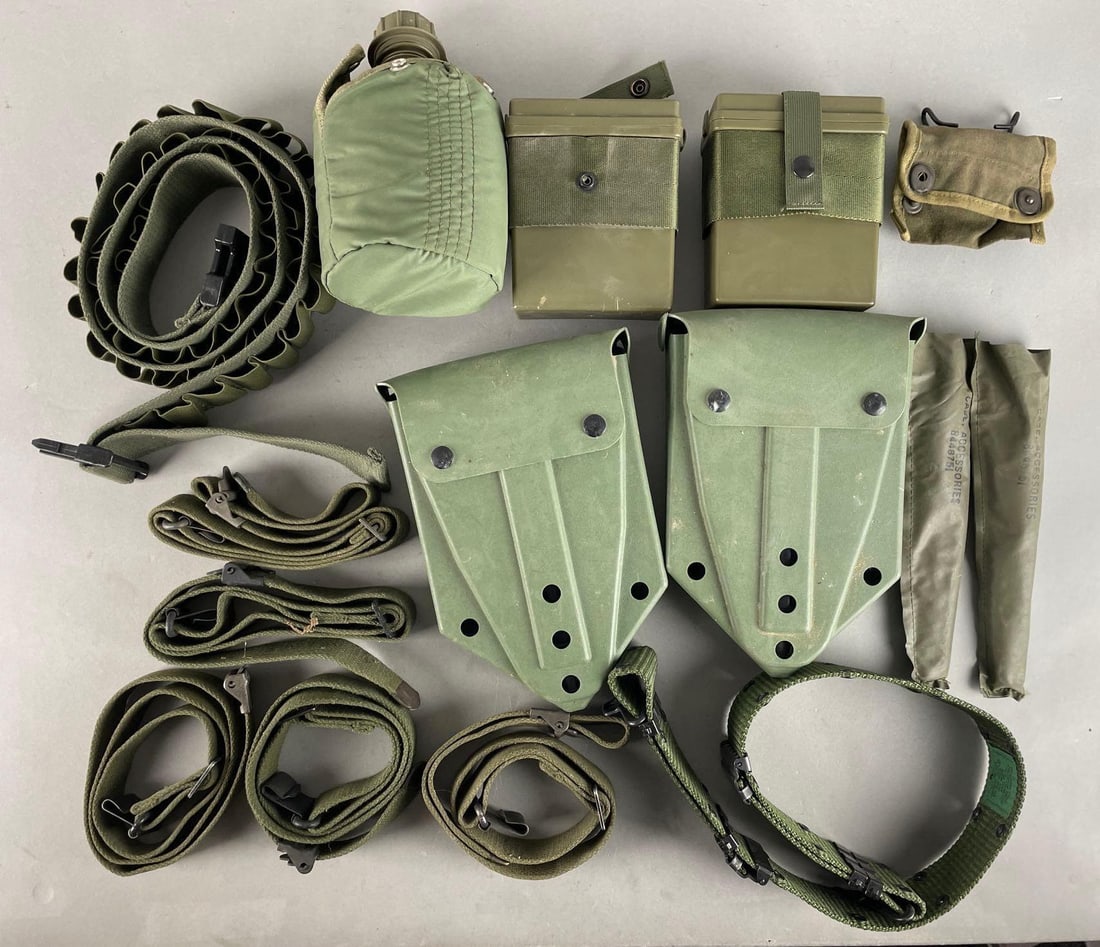 Group of U.S. Military Belts and Accessories: Includes entrenching tools, first aid kits, canteen, and more. Shovel cases measure 10 x 7 x 3 inches