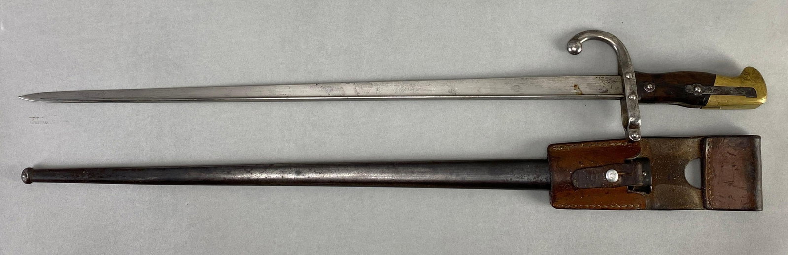 WW1 French Model L/1874 Epee Bay Bayonet with Scabbard: Serial # 94982, measures 25 1/2 in length with a 20 1/2 inch blade